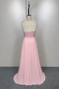 Back view of a pink halter neck evening dress with lace bodice and chiffon skirt