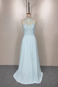 Elegant light blue halter neck evening gown with intricate lace bodice and chiffon skirt.