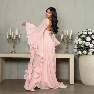 Elegant pink mesh evening gown with long ruffle sleeves and an open back strap design