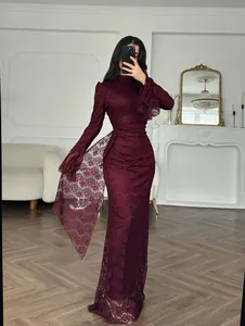 Elegant burgundy lace evening gown with long sleeves and side drape detail
