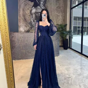 Elegant navy blue lace long-sleeved maxi dress with a corset waist and high front slit