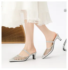 Elegant silver rhinestone mesh mules with pointed toe and comfortable mid-heel