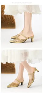 Detailed view of elegant gold hollow-out mule heels with sparkling rhinestone decor