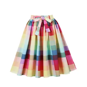 Detailed view of a colorful rainbow plaid midi skirt with a high waist and bow tie