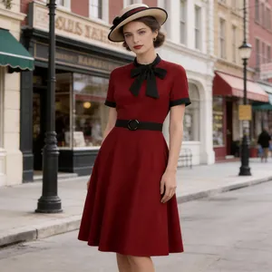 Full view of elegant wine red vintage midi dress with black bow tie and belt detail