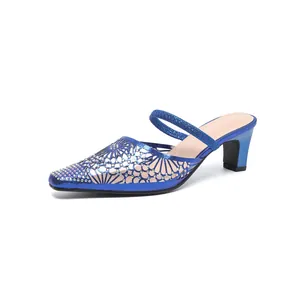 Elegant blue pointed-toe mule sandals with hollow rhinestone design and high heels