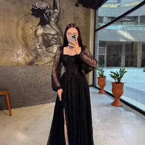 Sophisticated black lace long-sleeved corset maxi dress with elegant side slit detail