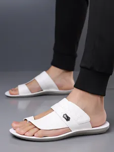 Close-up view of white men's outdoor beach sandals with textured strap and soft sole