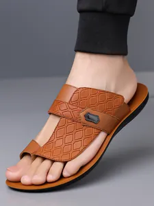 Close-up of brown leather men's sandals with woven texture detail