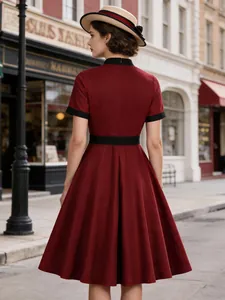 Elegant vintage wine red midi dress with contrast black trim and a stylish flared skirt