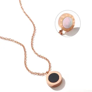Elegant rose gold necklace featuring a classic Roman numeral circular pendant with detail zoom