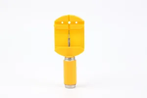 Detail view of a yellow plastic watch link remover tool for bracelet adjustment