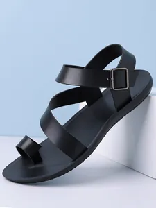 Detail view of stylish black men's toe-ring sandals featuring a secure buckle ankle strap