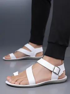 Detailed view of stylish white men's toe-loop sandals with adjustable metal buckle strap