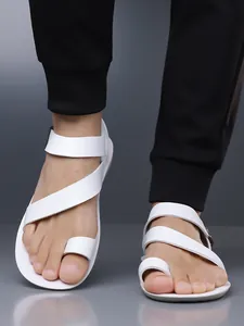 Close-up view of stylish white cross-strap men's sandals with toe loop for summer wear
