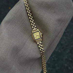 Elegant vintage gold square watch for women with Roman numeral dial and link bracelet