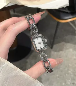 Detailed view of a silver retro quartz watch with a unique link chain strap design.