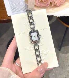 Vintage silver chain strap quartz watch for women with minimalist design and retro style