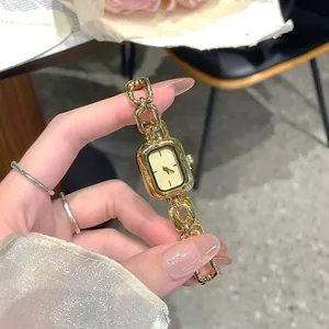 Elegant vintage gold quartz watch for women featuring a unique and stylish chain strap