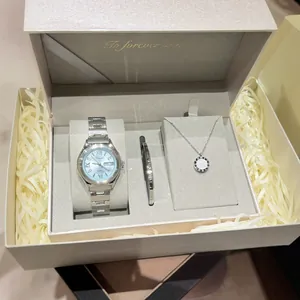 Elegant silver women's quartz watch gift set with blue dial, necklace and bracelet