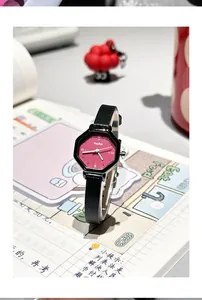 Detailed macro view of the hexagonal black case and dark red dial of this stylish quartz watch.
