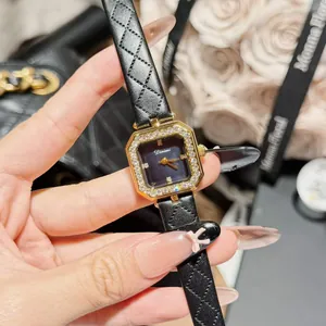 Close-up of elegant square women's watch with rhinestone bezel and rhombus leather strap
