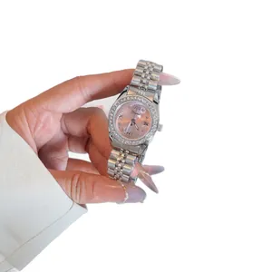Elegante reloj de cuarzo para mujer con bisel de diamantes y esfera rosa en acero
