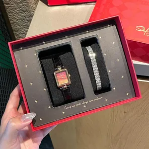 Geschenkset mit Vintage-Damenuhr und Diamantarmband in einer roten Geschenkbox
