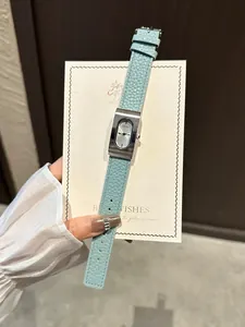 Close-up detail of GUOU vintage square quartz watch featuring a light blue leather strap