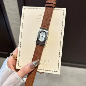 Vintage minimalist rectangular women's quartz watch with brown leather strap and silver case
