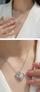 Detailed view of an elegant 1 carat moissanite heart pendant necklace worn on a model