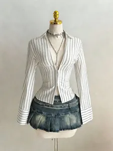 Detail view of a striped slim-fit V-neck shirt with a zipper and flared cuffs.
