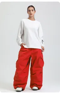 Full view detail of professional loose red waterproof ski pants for winter outdoor sports
