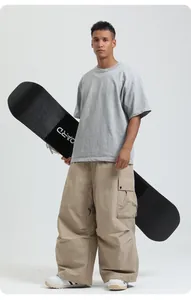 Detailed view of American style loose waterproof snowboard pants in khaki