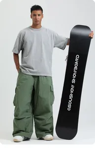Detailed full-length view of loose-fit green waterproof snowboarding cargo pants