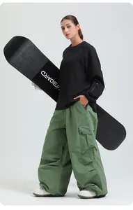 Professional loose green waterproof cargo ski pants for winter outdoor snowboarding sports