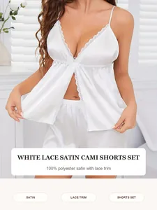 Elegant detail showing a white lace satin cami and shorts pajama set on a model