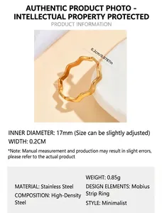 Close-up detail of gold-plated stainless steel Mobius ring showing dimension measurements