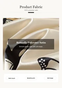 Close-up of butterfly print polyester satin fabric with a smooth glossy finish