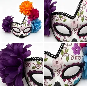 Detailed close-up of Mexican Day of the Dead floral mask with vibrant fabric flowers