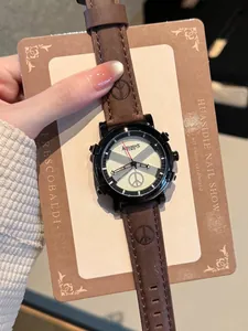 Detailed view of Assassin's Time quartz watch with brown leather strap and peace icons