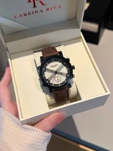 Detailed close-up of fashion quartz watch with brown leather strap in a premium gift box