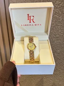 Detailed view of vintage gold bracelet watch in branded Lareina Rita gift box
