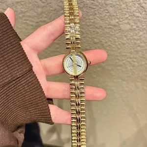 Vintage style gold ladies' bracelet quartz watch featuring a minimalist luxury design