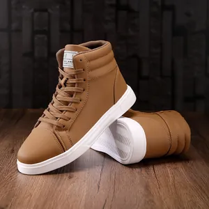 Detailed side view of stylish brown high-top fashion boots with white soles on wood floor