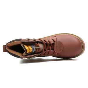 Top-down macro view of retro brown leather boots featuring lace-up detail and metal eyelets.