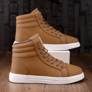 Detailed side view of stylish brown high-top leather fashion boots on wood surface