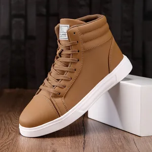 Close-up detail of tan faux leather high-top casual sneakers with white outsoles