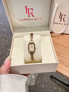 Elegant vintage gold women's watch with rectangular dial in a premium gift box.