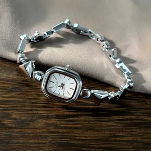 Elegant silver-toned retro quartz watch featuring irregular geometric chain bracelet